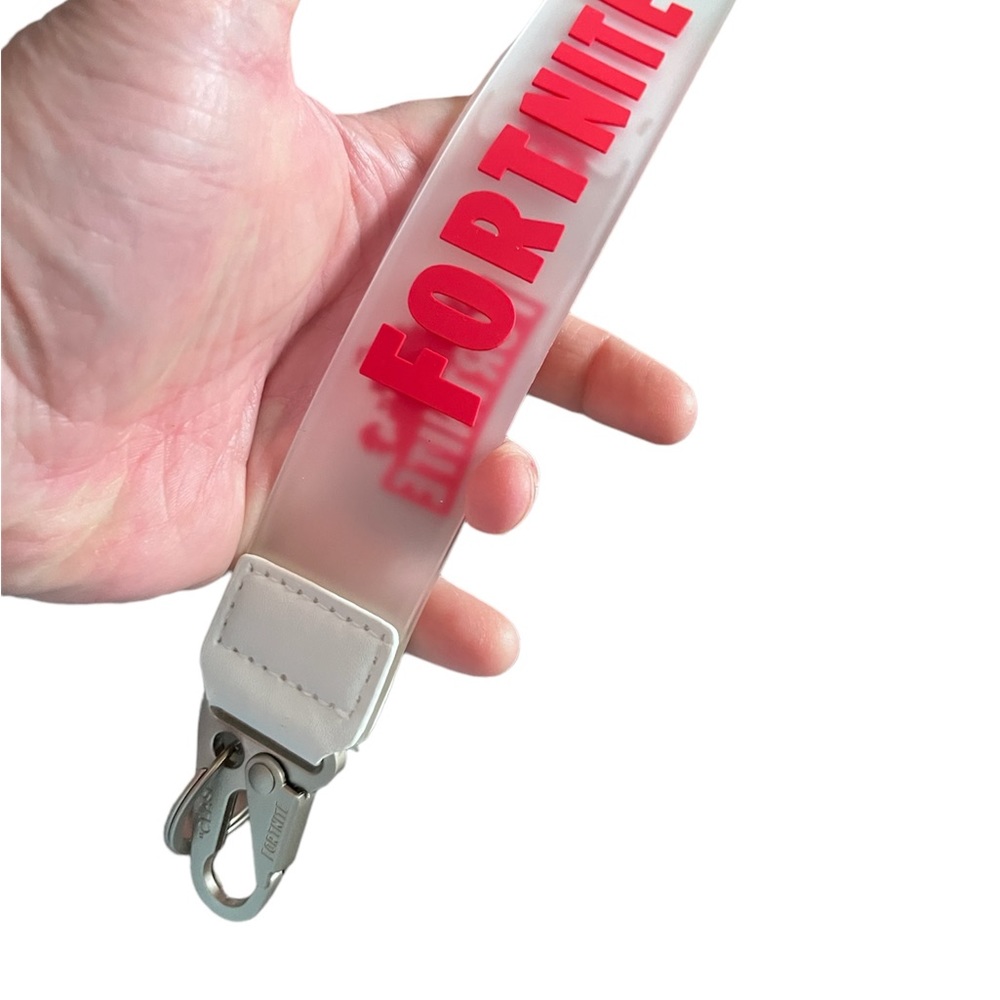 Officially licensed Fortnite gear. ￼ Heavy duty, lanyard keychain in red